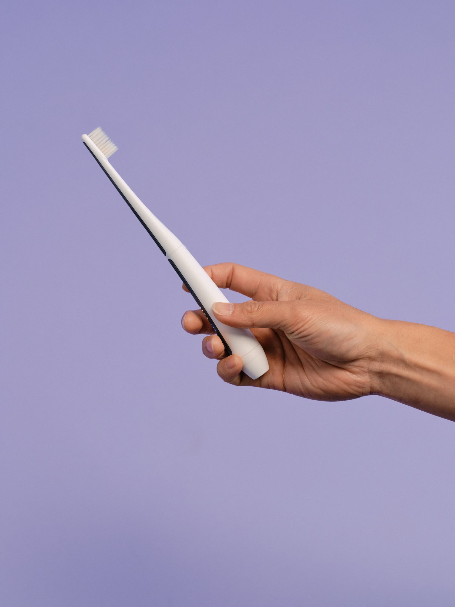 Side profile view of the Oreze pet toothbrush