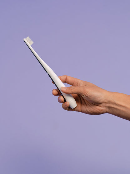 Side profile view of the Oreze pet toothbrush