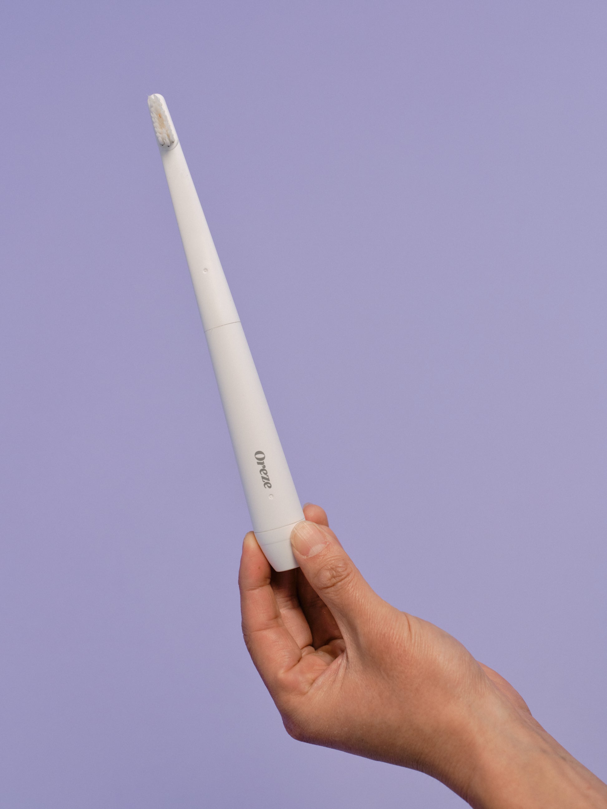 Frontal view of the Oreze pet toothbrush